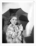 1960s Woman With Umbrella Holding Bags Of Money Save Your Money For A Rainy Day by Anonymous