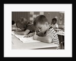 1960s Boy Striped T-Shirt Elementary School Classroom Sitting Desk Writing Test by Anonymous