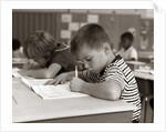 1960s Boy Striped T-Shirt Elementary School Classroom Sitting Desk Writing Test by Anonymous