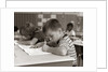 1960s Boy Striped T-Shirt Elementary School Classroom Sitting Desk Writing Test by Anonymous