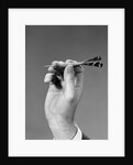 1960s 1970s Hand Close-Up Holding About To Throw A Sharp Pointed Dart by Anonymous