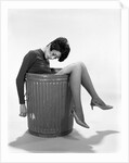 1960s Young Woman In Trash Can by Anonymous