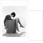 1960s Young Woman In Trash Can by Anonymous