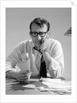 1960s Man With Pile Of Bills And Worried Expression by Anonymous