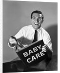 1960s Man Father Holding Baby Care Book by Anonymous