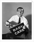 1960s Man Father Holding Baby Care Book by Anonymous
