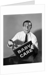 1960s Man Father Holding Baby Care Book by Anonymous