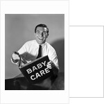 1960s Man Father Holding Baby Care Book by Anonymous