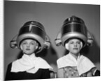 1950s Two Women Under Hair Dryers Towels Around Shoulders Hair Nets by Anonymous