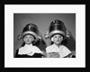 1950s Two Women Under Hair Dryers Towels Around Shoulders Hair Nets by Anonymous