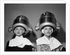 1950s Two Women Under Hair Dryers Towels Around Shoulders Hair Nets by Anonymous