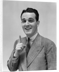 1940s Man In Suit Holding Up Index Finger Making A Point by Anonymous
