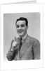 1940s Man In Suit Holding Up Index Finger Making A Point by Anonymous