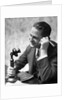 1920s Businessman Talking Into Candlestick Telephone by Anonymous