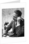 1920s Businessman Talking Into Candlestick Telephone by Anonymous