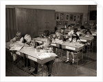 1960s Elementary Classroom Children At Desks Writing Studying by Anonymous