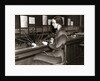 1930s Woman Telephone Operator Sitting At Large Manual Switchboard Directing Calls by Anonymous