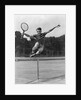 1930s Teenage Boy Tennis Player Jumping Net With Racket In Hand by Anonymous