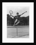 1930s Teenage Boy Tennis Player Jumping Net With Racket In Hand by Anonymous