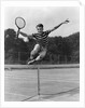 1930s Teenage Boy Tennis Player Jumping Net With Racket In Hand by Anonymous