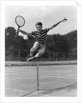 1930s Teenage Boy Tennis Player Jumping Net With Racket In Hand by Anonymous