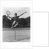 1930s Teenage Boy Tennis Player Jumping Net With Racket In Hand by Anonymous