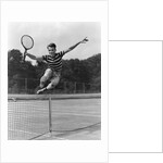 1930s Teenage Boy Tennis Player Jumping Net With Racket In Hand by Anonymous
