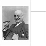 1930s Elderly Businessman In 3-Piece Suit and Glasses Leaning Back With Cigar In Hand by Anonymous