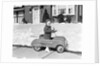 1930s 1940s Little Boy Playing In Toy Car Outside In Snow by Anonymous