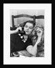 1930s Young Brunette Woman Reclining On Pillows Cigarette In Hand Talking On Telephone by Anonymous