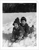 1930 1930s Boy And Girl Laughing Sledding In Snow by Anonymous