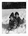 1930 1930s Boy And Girl Laughing Sledding In Snow by Anonymous