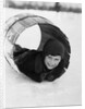 1920s Boy Playing Lying In Snow Rolling In Wooden Barrel by Anonymous
