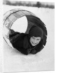 1920s Boy Playing Lying In Snow Rolling In Wooden Barrel by Anonymous