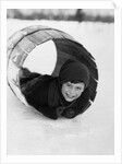 1920s Boy Playing Lying In Snow Rolling In Wooden Barrel by Anonymous