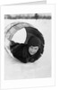 1920s Boy Playing Lying In Snow Rolling In Wooden Barrel by Anonymous