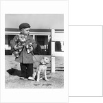 1940s Boy With Puppy On Leash Holding Christmas Present by Anonymous