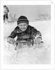 1940s Boy On Sled In Snow Facing Camera Hands And Jacket Covered In Snow by Anonymous