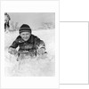 1940s Boy On Sled In Snow Facing Camera Hands And Jacket Covered In Snow by Anonymous