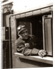 1920s 1930s 1940s Railroad Train Engineer Looking Out Window Of Locomotive Cab Driving The Steam Engine by Anonymous