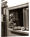 1920s 1930s 1940s Railroad Train Engineer Looking Out Window Of Locomotive Cab Driving The Steam Engine by Anonymous