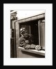 1920s 1930s 1940s Railroad Train Engineer Looking Out Window Of Locomotive Cab Driving The Steam Engine by Anonymous