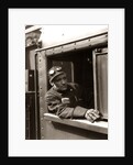 1920s 1930s 1940s Railroad Train Engineer Looking Out Window Of Locomotive Cab Driving The Steam Engine by Anonymous