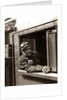 1920s 1930s 1940s Railroad Train Engineer Looking Out Window Of Locomotive Cab Driving The Steam Engine by Anonymous
