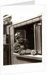 1920s 1930s 1940s Railroad Train Engineer Looking Out Window Of Locomotive Cab Driving The Steam Engine by Anonymous