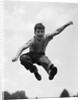 950s Boy Jumping Up by Anonymous