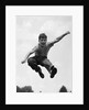 950s Boy Jumping Up by Anonymous