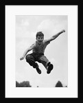 950s Boy Jumping Up by Anonymous
