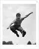 950s Boy Jumping Up by Anonymous