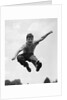 950s Boy Jumping Up by Anonymous